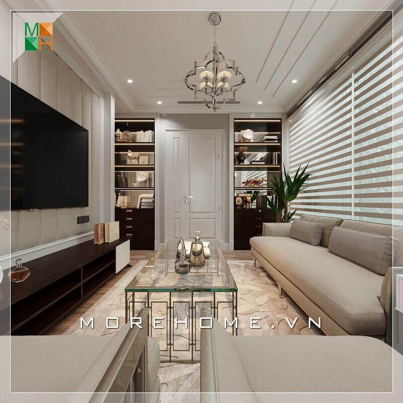 Một phòng khách tân cổ điển đẹp sẽ phải thể hiện được rõ nhất tính năng của nó bằng cách lựa chọn nội thất thông minh và lựa chọn màu sắc phù hợp nhất đối với thiết kế ngôi nhà. Lựa chọn một bộ sofa sang trọng màu kem sữa kết hợp với chiếc bàn bằng kính rất đẳng cấp, Kệ TV nhìn khá đơn giản nhưng rất hài hòa với những nội thất khác trong căn phòng. Sự kết hợp nội thất trong căn phòng khách ăn ý và logic đã tạo nên một không gian phòng khách tiện nghi và sang trọng. Tổng hợp những mẫu sofa phòng khách tiện nghi nhất